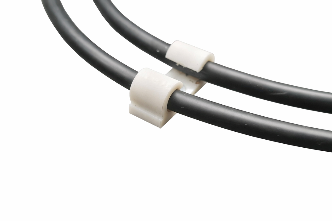 Close up showing ho campermade cable clip holds cable in a saddled position